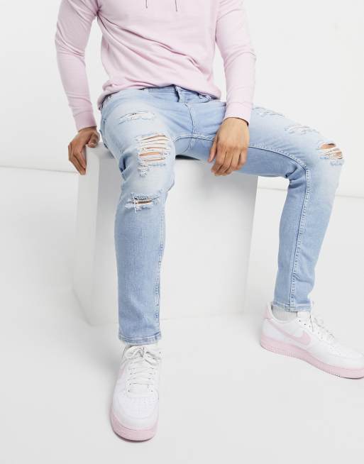 Bershka premium super skinny fit jeans with rips in blue