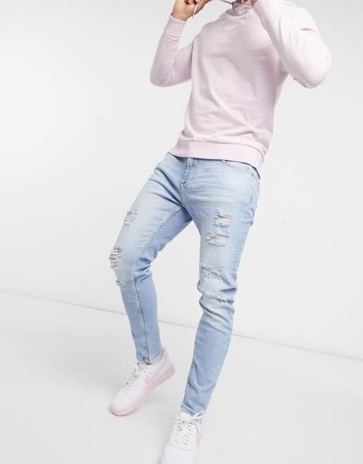 Bershka premium super skinny fit jeans with rips in blue