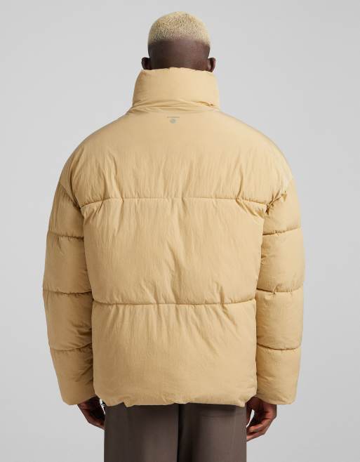 Bershka puffer jacket in beige