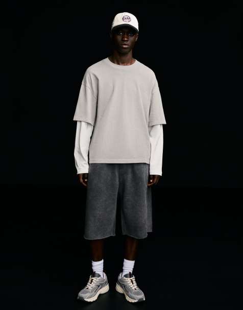 Bershka Raw-edge jersey bermuda shorts in black - view 1