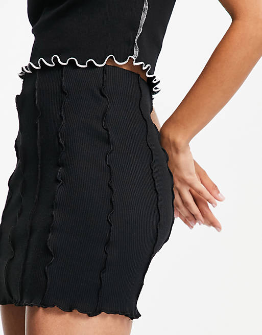 Bershka recycled cotton exposed seam mini skirt in black