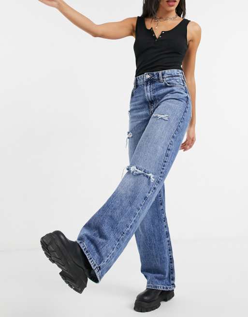 Bershka ripped 90's jean in medium blue wash | ASOS