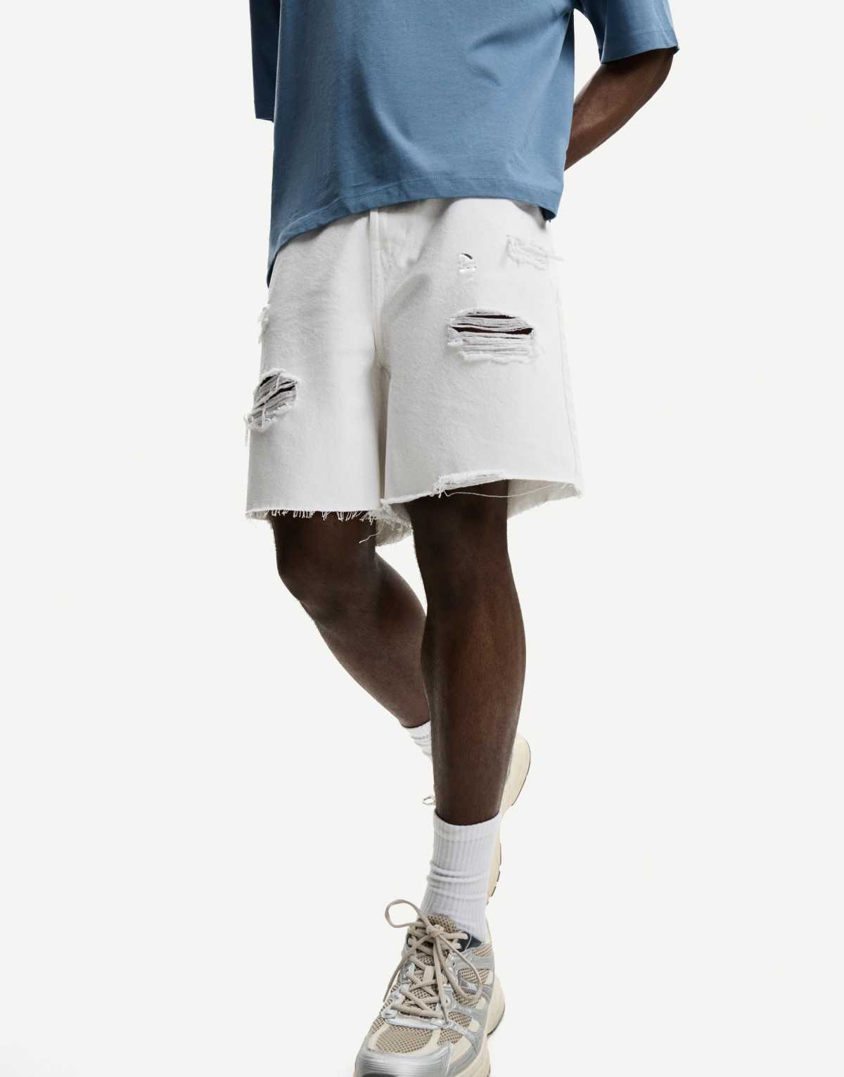 Bershka ripped denim bermuda shorts in white