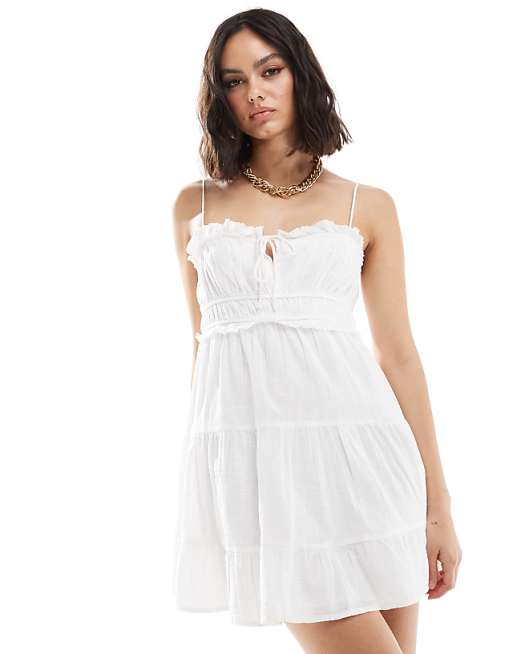 Bershka ruffle detail strappy mini dress in white | ASOS Bershka ruffle detail strappy mini dress in white | ASOS