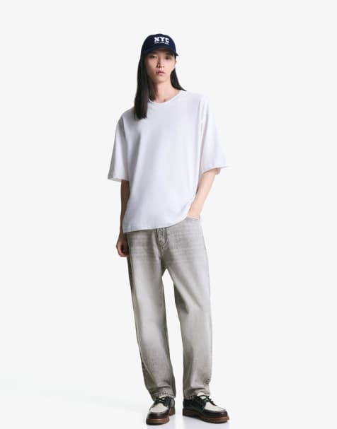 Bershka – Schmal zulaufende, locker geschnittene Jeans in Hellgrau - view 1