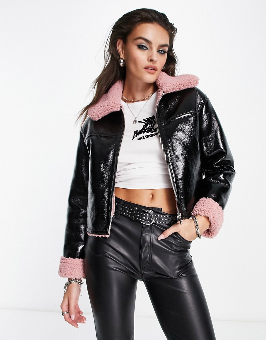 Bershka shearling detail cropped jacket in black vinyl with pink trim