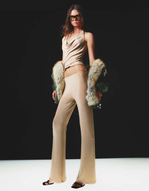 Bershka Shimmery flared trousers in gold