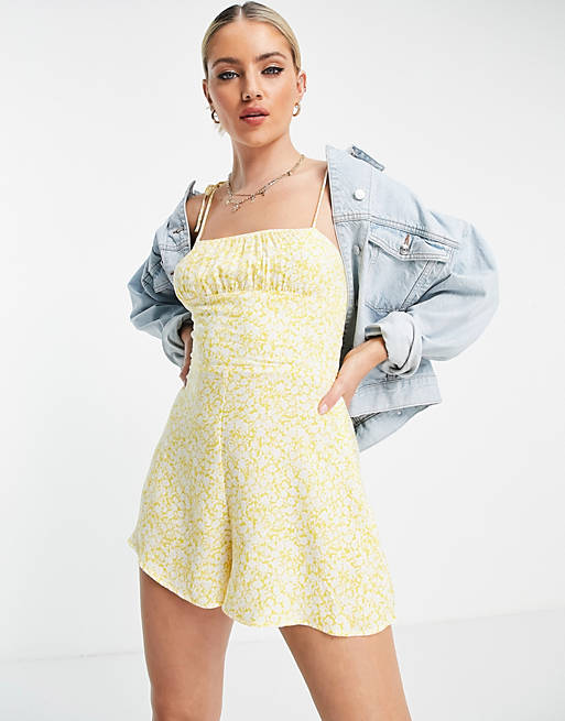 Bershka shirred floral tie strap playsuit in yellow