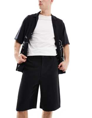 BOSS - Pantalon Relaxed Fit boutonné en coton stretch - Noir