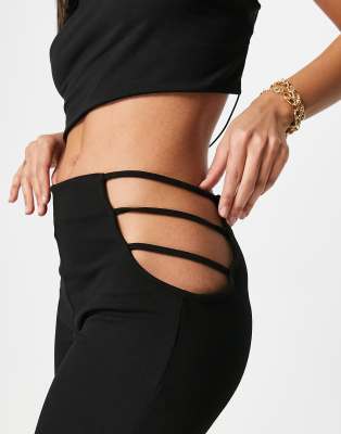 Bershka side cut out strappy flare pants in black | ASOS