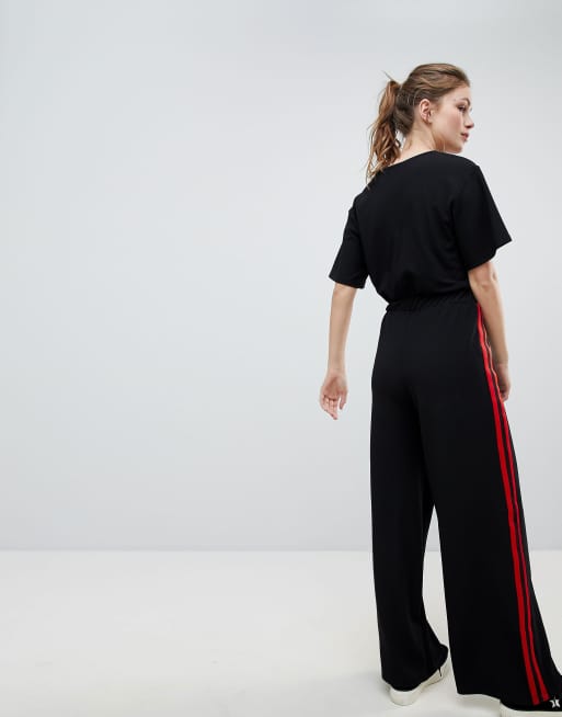 Black jumpsuit with cheap white stripe on side