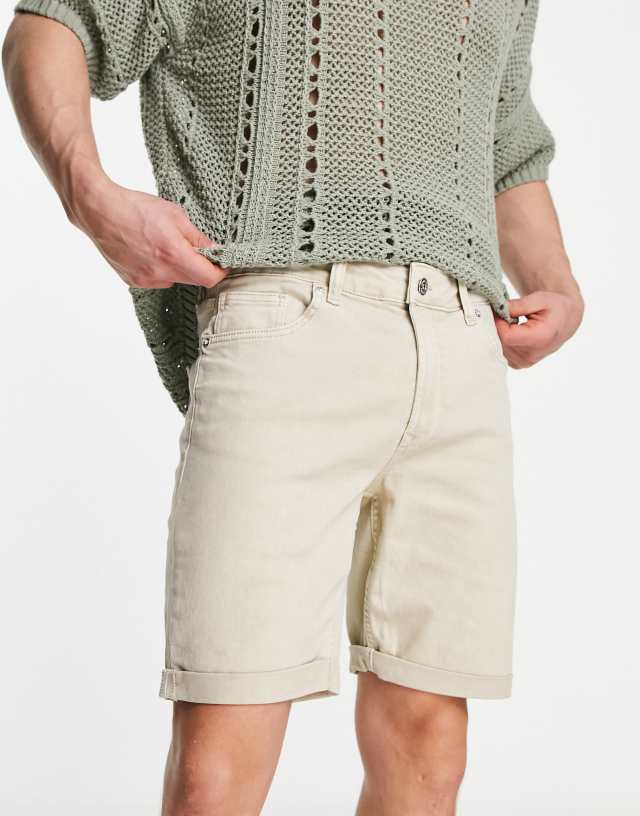 Bershka skinny denim roll up shorts in beige