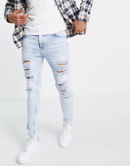 Bershka skinny fit jeans with rips in light blue