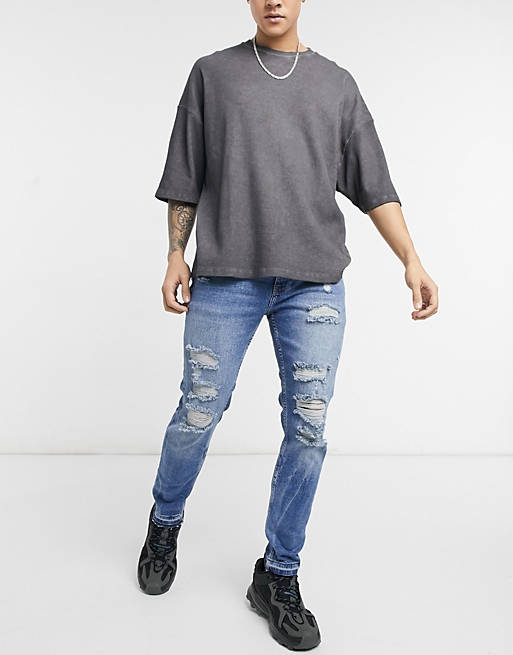 Bershka skinny fit jeans with rips in mid blue