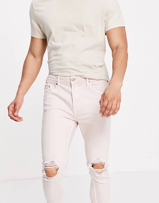 Jeans Bershka skinny fit jeans with rips in washed pink 