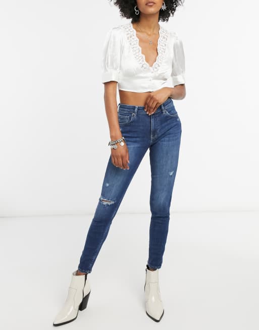 Bershka skinny push up jean with knee rip in dark blue wash