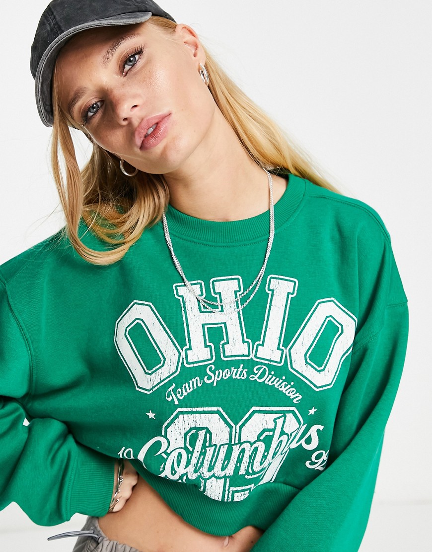 Bershka slogan cropped sweatshirt in green