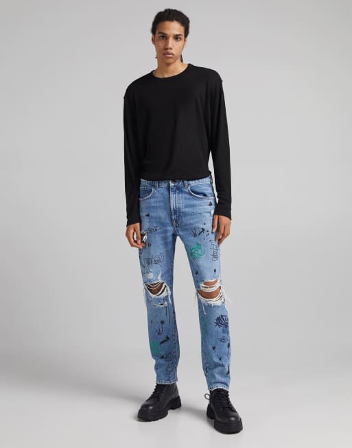 Bershka straight ripped jeans with graffiti print in blue