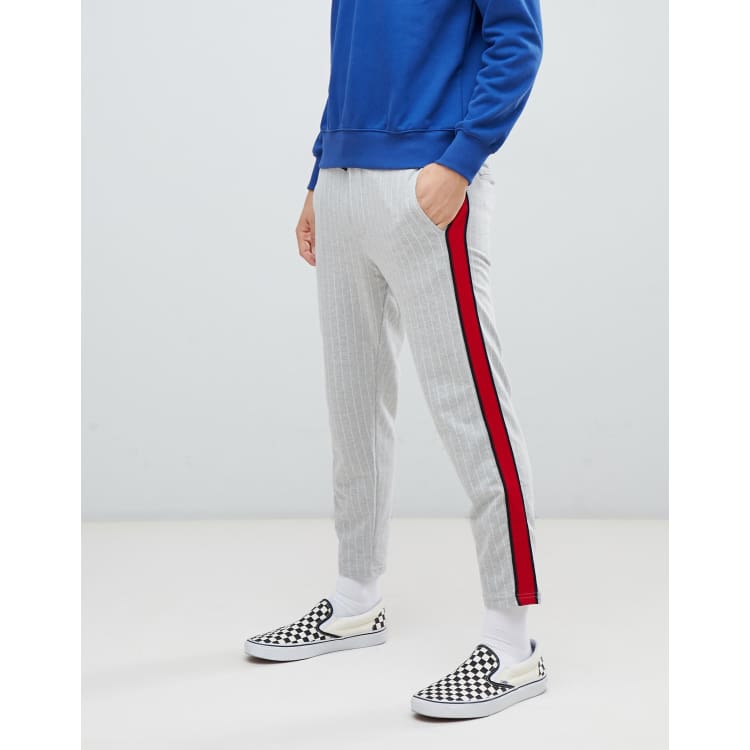 Red sweatpants store with white stripe