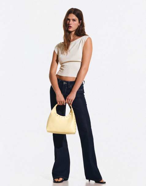 Bershka Studded leather effect bucket bag in yellow - view 1