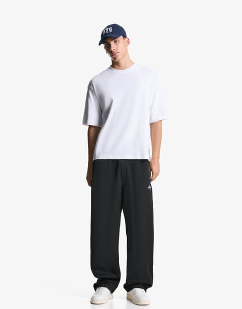 Bershka Super baggy jogger trousers in black - view 1