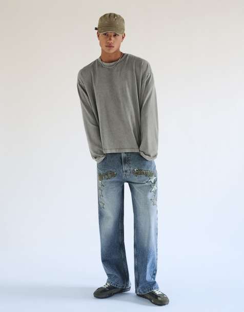 Bershka Super baggy star patch jeans in mid blue - view 1