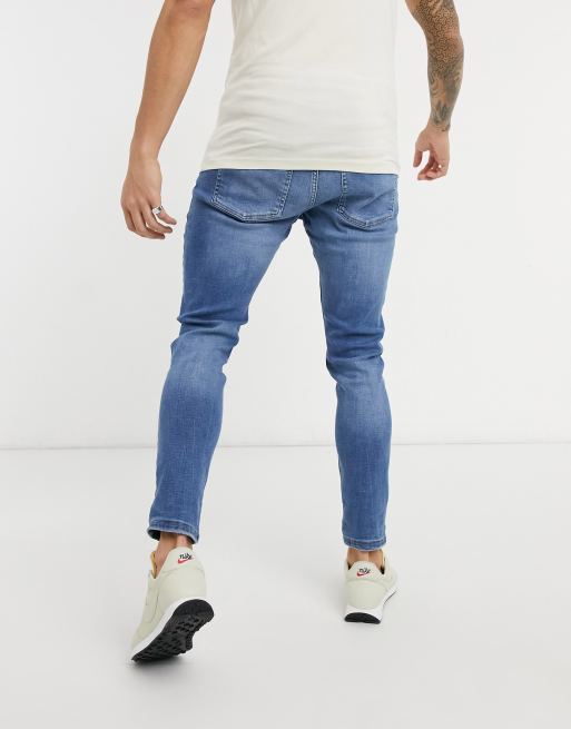 microscópico Rusia Romper Bershka super skinny fit jeans in dark blue wash | ASOS