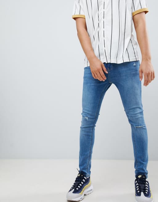 Bershka Super Skinny Jeans In Blue With Knee Rips Asos