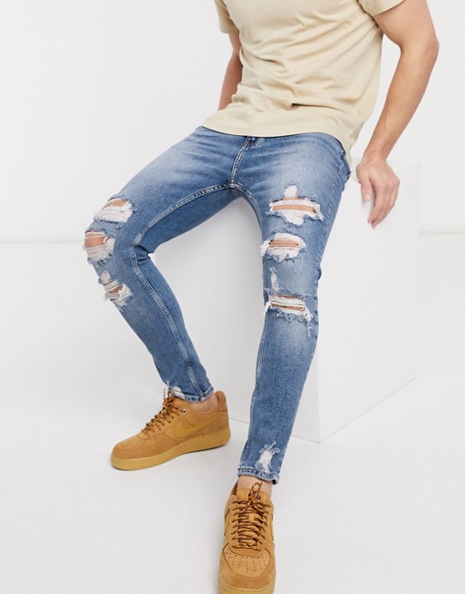 Bershka super skinny jeans with rips in mid blue