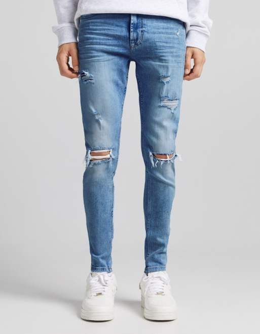 Bershka super skinny jeans with rips in midwash blue ASOS