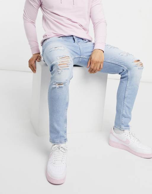 Bershka – Superenge Premium-Jeans mit Zierrissen in Blau