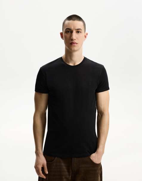 Bershka - T-shirt à manches courtes retroussées et détail brodé - Noir - view 1