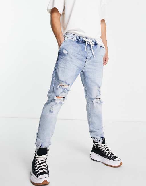 Bershka tapered jeans in mid blue