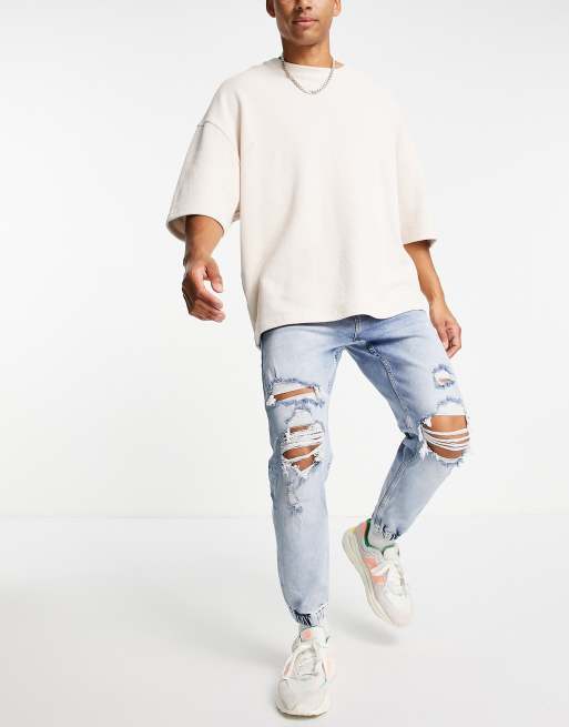 Bershka tapered jeans in mid blue