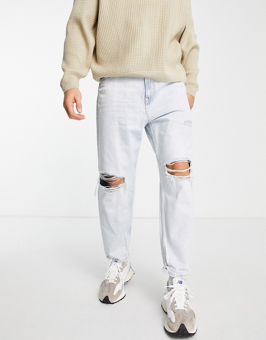 Bershka tapered jeans with rips in light blue-Blues