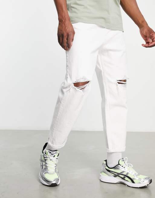 Bershka tapered jeans with rips in | ASOS