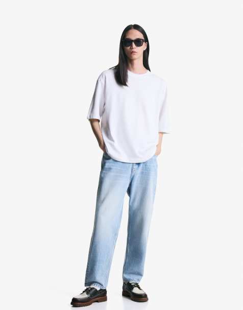 Bershka Tapered loose fit jeans in mid blue - view 1