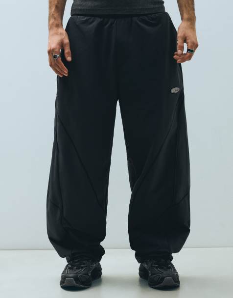 Bershka Technical barrel trousers in black - view 1