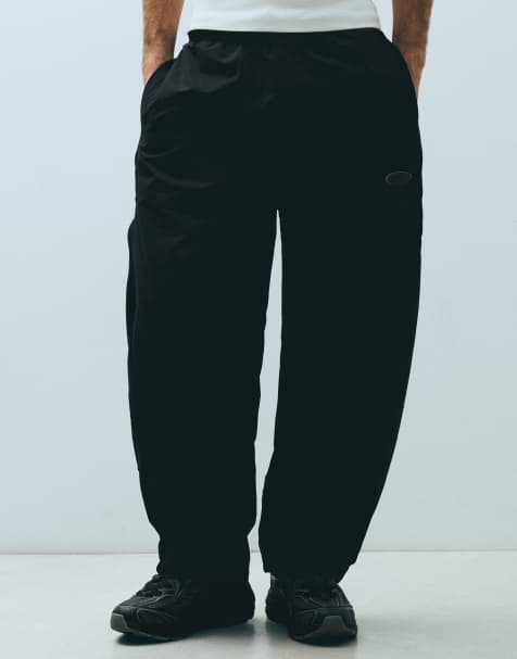 Bershka Technical barrel trousers in black - view 1