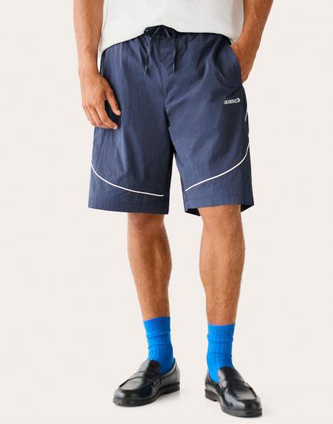 Bershka Technical skater shorts with contrast piping in blue - view 1