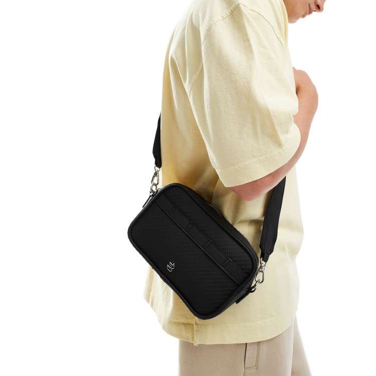 Bershka textured cross body bag in black ASOS