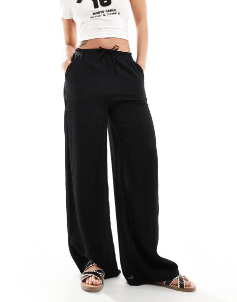 Bershka tie waist crinkle wide leg trousers in black - view 1