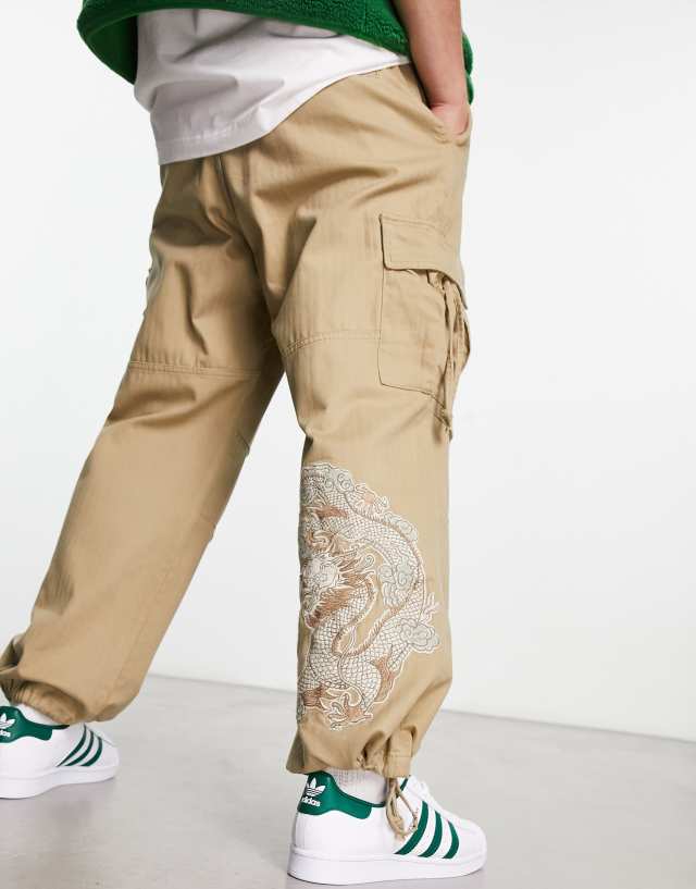 Bershka tiger embroidered cargo pants in camel