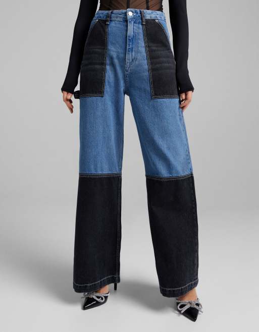 Bershka - Tømrerjeans med vide ben og blåt/sort patchwork-design