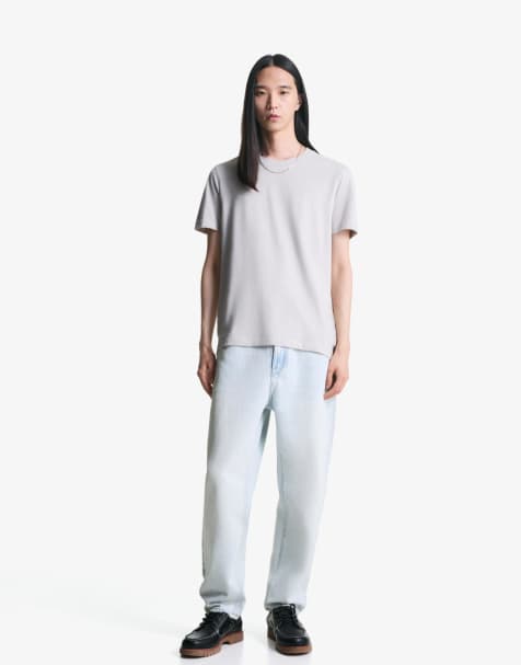 Bershka - Toelopende jeans met losse pasvorm in lichtblauw - view 1