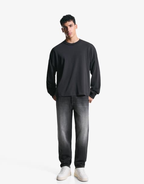 Bershka - Toelopende jeans met losse pasvorm in zwart - view 1