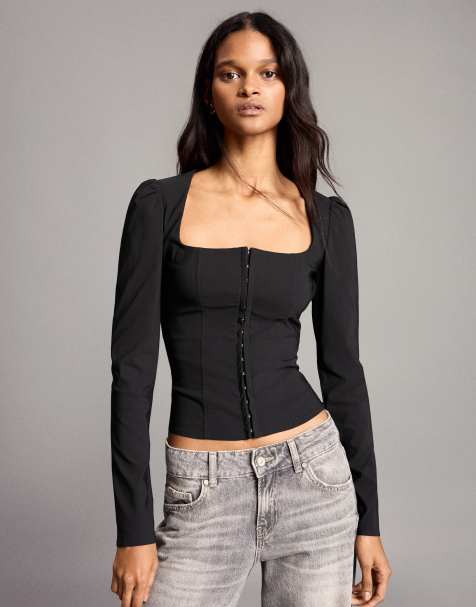 Bershka top corsetto a maniche lunghe con bottoni a pressione nero - view 1