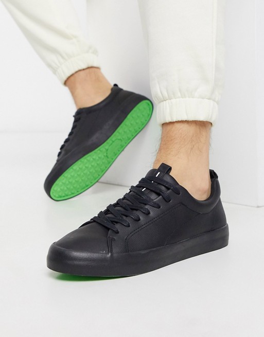 Bershka trainers in black with bright green sole