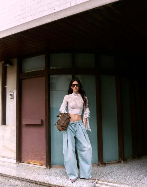 Bershka Twisted pleat jeans in mid blue - view 1