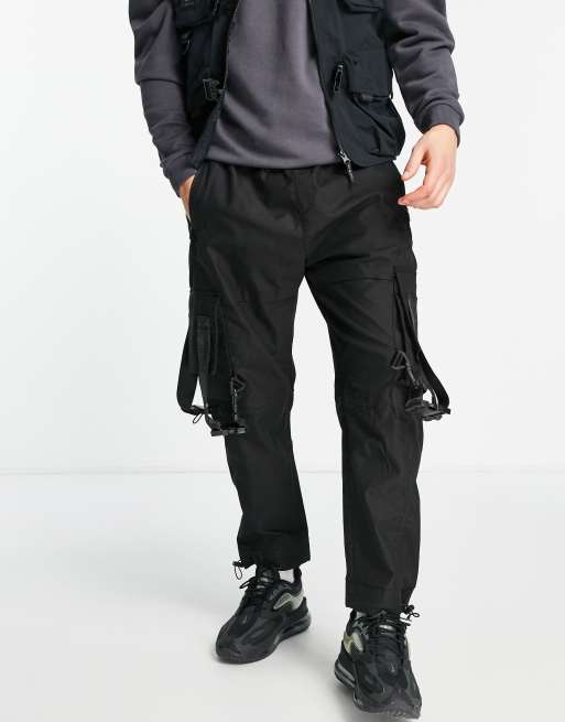 Bershka utility cargo pants with pockets in black